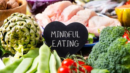vegetables with a sign that says mindful eating