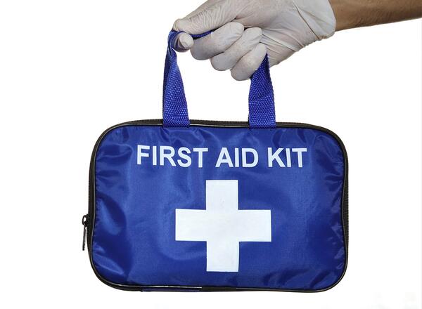 person holding first aid kit